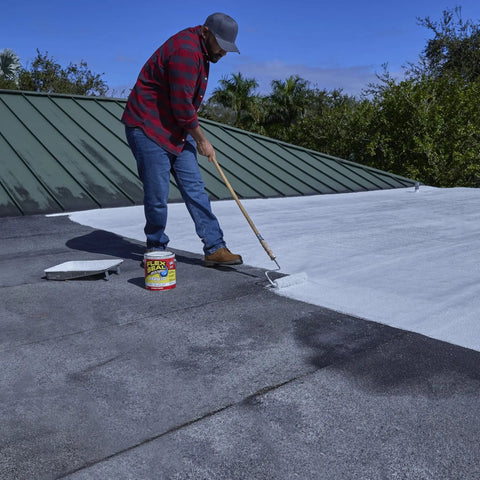 Person applying Liquid Rubber Coating Sealant For Waterproof, Flexible Protection On Roofs, Basements, RVs, Campers, Trailers, Marine Surfaces And Masonry White One Gallon With UV Resistant Breathable Finish And Easy Brush Or Pour Application to roof.