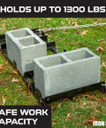 Drag Harrow Driveway Grader Attachment, 4 Ft Heavy Gauge Welded Steel, Powder Coated Black shown with cinder blocks on grass