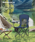 2 Pack Breathable Camping Chairs With High Back next to a tent by a lake, showing adjustable armrests and cup holder