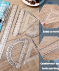Real Deal 7 Piece Geometry Set With Fine Tip Drawing Compass And 6 Plus 4 Inch Protractors Clear Triangle And Straight Ruler on wooden surface.