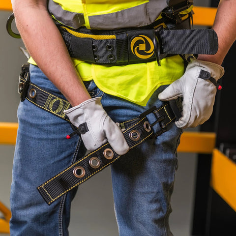 Person adjusting All Day Comfort Safety Harness With Waist Pad And Side D Rings For Worksite Use Boss Level OSHA ANSI Compliant