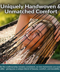 Smiling person relaxing in XXL Handwoven Mayan Double Hammock For Outdoor Use With Thick Cord 156 Inch Wide 90 Inch Deep And 625 Pound Capacity Heavy Duty Outdoor Hammock In Black And Natural.