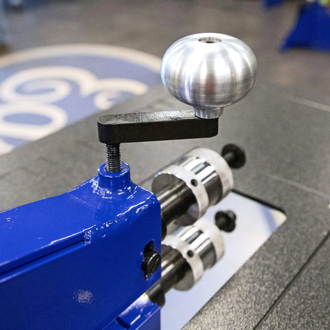 Killer Metal Fabrication Bead Roller Knobs For Motorized Units, aluminum ergonomic handle on blue metal roller.