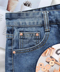 Close-up of jeans displaying copper rivets from the Copper Rivets And Burrs Kit, 20 Pieces In 14mm And 19mm for DIY leather crafting.