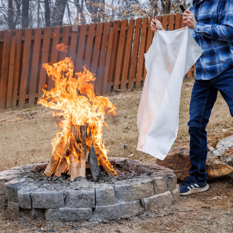 Person using Emergency Fire Blanket 40 By 40 Inches, Woven Fiberglass Fire Shield For Smothering Small Area Fires Up To 900 Degrees Fahrenheit