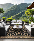 Reversible Waterproof Outdoor Rug 5x8 Ft For Patio Deck Porch RV Beach And Backyard With Black And Brown Geometric Pattern on patio