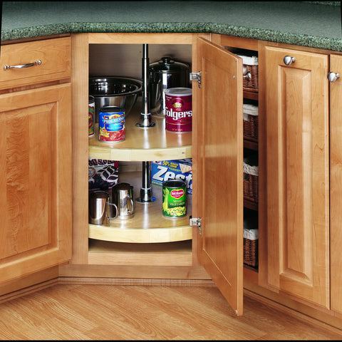 Premium Wood Lazy Susan Double Tier Turntable For Corner Base Cabinets showing maple shelves and storage items in a kitchen cabinet.