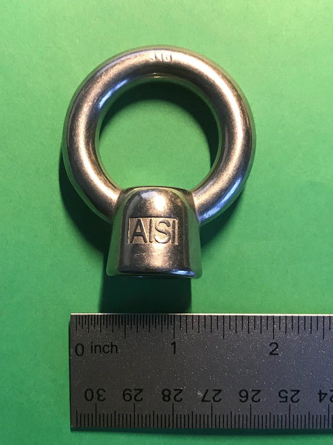 Marine Grade 316 Stainless Steel Lifting Eye Nut One Half Inch UNC Thread With Pitch 13 For Heavy Duty Hoisting shown with ruler