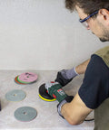 Man using 5 Inch Diamond Polishing Pads Wet Dry Set for Marble Quartz Granite Concrete, 8 Piece Kit on countertop
