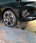 Reflective 2 Inch By 10 Foot Car Tie Down Straps with J Hooks securing a car