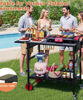 Foldable Grill Cart With Oversized Wheels For 17 To 22 Inch Grills, in use at a backyard party poolside setting.