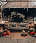 Outdoor patio with hanging swing, decorated with pumpkins and illuminated by smokeless 360 degree propane patio heater towers at night.