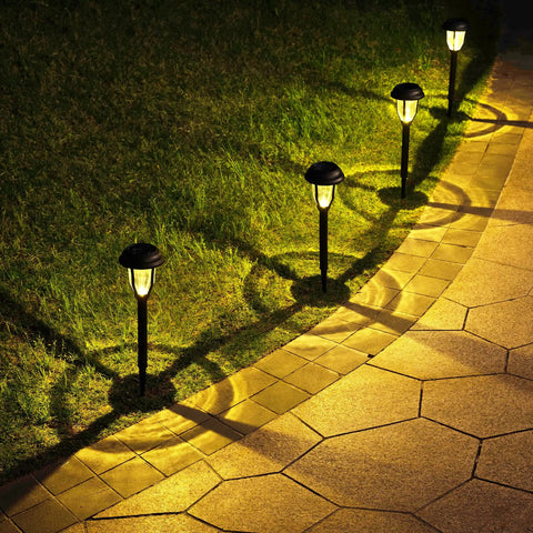 Eight Pack Solar Pathway Lights Waterproof Outdoor Garden Yard Landscape Walkway Driveway With Auto On Off And Energy Saving Warm White Glow Weather Resistant Easy Setup illuminating a walkway