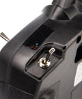 Close-up of DXS Transmitter With AR410 Receiver Delivers Smart Technology Telemetry, ergonomic grip with toggle switch detail.