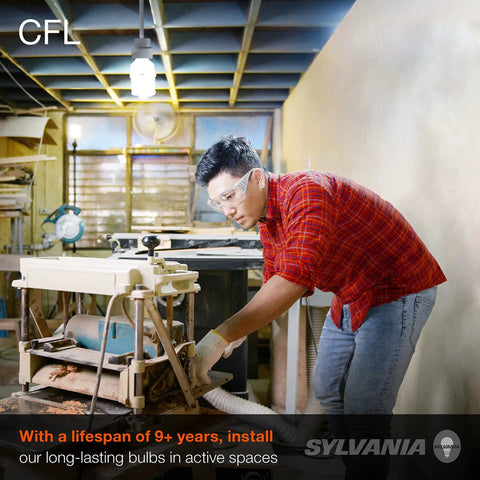 Person using machinery under CFL T2 Twist Light Bulb 60W Equivalent 13W 800 Lumens Daylight 6500K 3 Pack in workshop