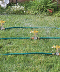 4 Pack 1/2 Inch Zinc Alloy Lawn Sprinkler Spike Bases With Water Flow Through Design for yard lawn and grass irrigation in use