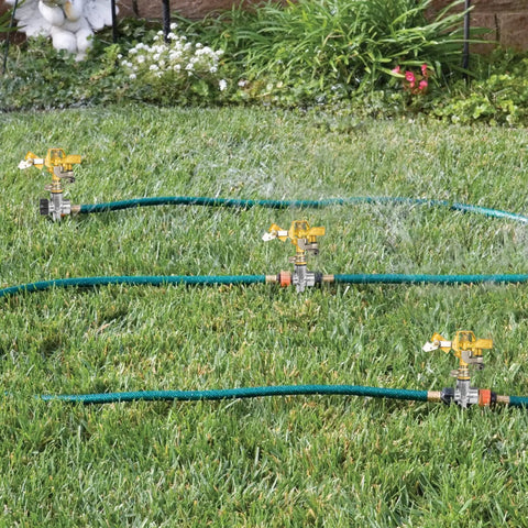 4 Pack 1/2 Inch Zinc Alloy Lawn Sprinkler Spike Bases With Water Flow Through Design for yard lawn and grass irrigation in use