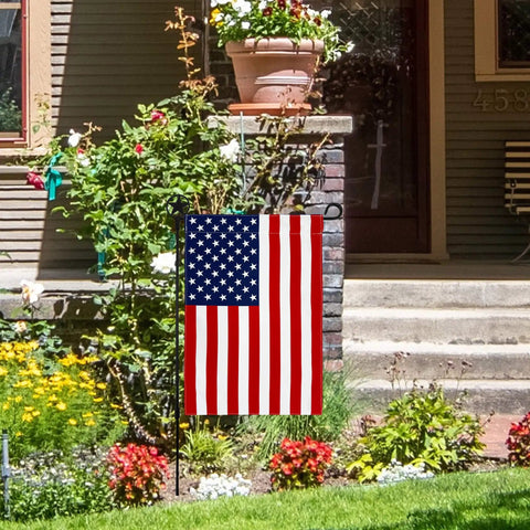 All American Fourth Of July Garden Flag in a yard, 12.5x19 inch patriotic decor, weather-resistant poly poplin, stars and stripes visible