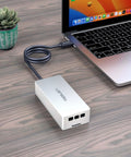 Fast Usb4 To Nvme Enclosure Syncing Thunderbolt 5, aluminum design connected to a laptop on a wooden desk.