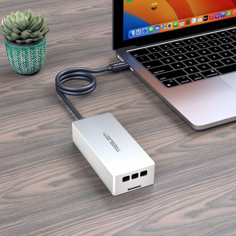 Fast Usb4 To Nvme Enclosure Syncing Thunderbolt 5, aluminum design connected to a laptop on a wooden desk.