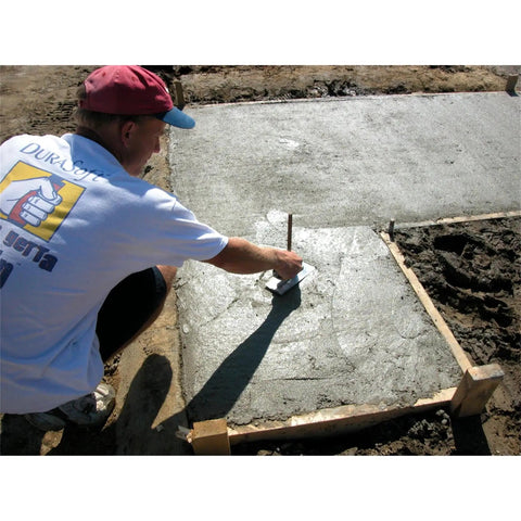Person using Mini Trowel For Finishing Concrete 8 Inch By 3 Inch Carbon Steel Blade With Lightweight Aluminum Xtralite Mounting on fresh slab