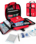 Red large first aid kit bag opened with labeled compartments and visible medical supplies