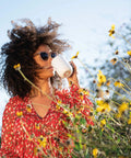 Keep Your Morning Brew Piping Hot With This App Controlled Smart Mug 10 Ounce White Heated Coffee Cup held outdoors with flowers
