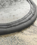 Water Activated 10ft Flood Barrier Pack Of 8 Reusable Absorbers diverting water on wet surface