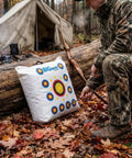 Beast-Size Outdoor Archery Target Bag 36 By 30 By 11 Inches beside a log, camo-clad archer in forest setting.