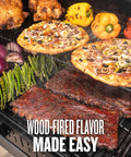 Woodridge Pro Electric Wood Pellet Grill And Smoker With pizzas, vegetables, and ribs showing wood-fired cooking results.