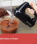 Close-up of a Six Speed Easy Storage Hand Mixer With Five Attachments And Case No Fuss Cleanup Lightweight Ergonomic Design in use