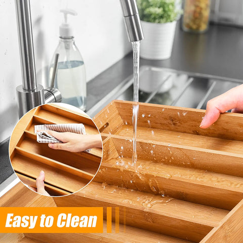 Sleek Expandable Bamboo Drawer Organizer For Kitchen Flatware Holder With Hassle Free Adjustable Compartments being washed under running water.