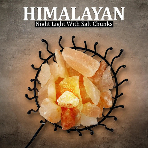 Close-up of a Pink Himalayan Salt Lamp with dimmer switch in a tall round metal basket, 8 to 10 lbs with glowing salt chunks.