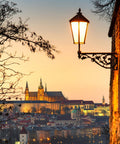 Street lamp overlooking cityscape at dusk with castle view, warm lighting matches Set It And Forget It Dusk To Dawn Photocell LED Light Bulbs