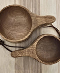 Top view of two Kuksa Wooden Cup Handcarved 8 Oz Coffee Mug With Lanyard And Carabiner For Camping Outdoors, natural wood finish