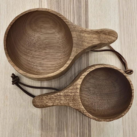 Top view of two Kuksa Wooden Cup Handcarved 8 Oz Coffee Mug With Lanyard And Carabiner For Camping Outdoors, natural wood finish
