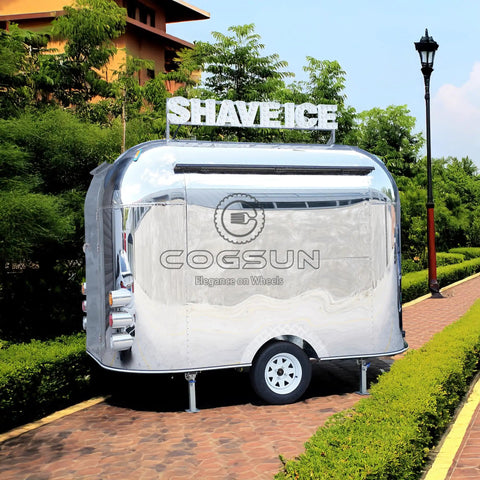 Premium Polished Mirror Food Trailer With Fold Down Awning And Stainless Steel Counter Space For Concession Operators And Mobile Coffee Shops Solid Gear To Crush Sales Daily, shiny exterior with 'SHAVE ICE' sign.