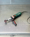 Heavy Duty Variable Speed Die Grinder With Badass High Torque Planetary Gears And Easy Swap Spindle Lock on metal surface