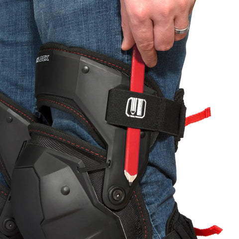 Person wearing Weight Dispersion Foam Pro Grade Knee Pads With Thigh Stabilization For Floor And Roof Projects Built Tough Poly Shell And 1680D Lining Adjustable Fit For All Day Comfort One Pair while holding a pencil against the strap.