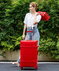 Woman holding Vintage Inspired 3-Piece Luggage Set With Hardside Red Crocodile-Embossed Finish Lightweight Spinner Suitcases
