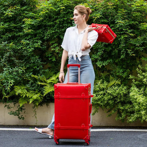Woman holding Vintage Inspired 3-Piece Luggage Set With Hardside Red Crocodile-Embossed Finish Lightweight Spinner Suitcases