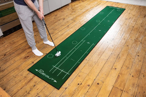 Person practicing on Big Time Golf Putting Mat For Home Practice 367cm By 67cm With Five Independent Targets Alignment Lines Foot Markings