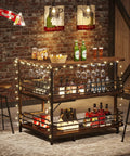 L Shaped Home Bar Unit With 3 Tier Storage Shelves And Wine Glass Holder For Kitchen Or Living Room Rustic Brown And Matte Black Industrial Corner Bar Cabinet With Pub Vibe showcasing illuminated shelves with bottles and glasses.