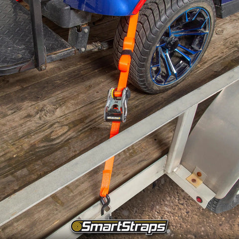 4 Pack 14 Ft Ratchet Straps With Badass 3000 Lb Break Strength And 1000 Lb Safe Work Load securing a bike on a trailer.