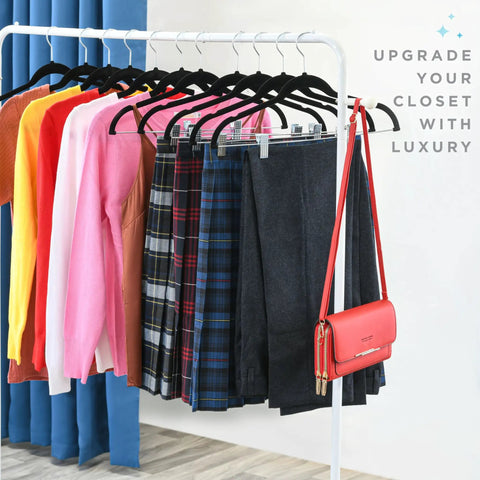 Ultra Thin Velvet No Slip Pants Hangers With Clips 10 Pack holding various clothes on a rack