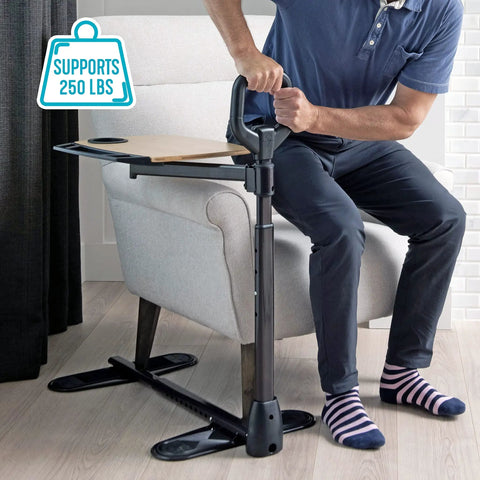 Person demonstrating Adjustable Bamboo Tray Table With Ergonomic Safety Handle And Stand For Couch Or Lap, supports 250 lbs