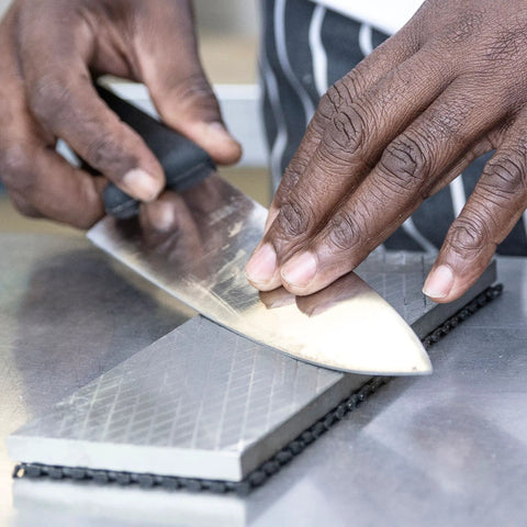 Using the All In One Pro Grade Diamond Sharpening Kit with 180 600 and 300 1000 grit diamond stones to sharpen a kitchen knife.