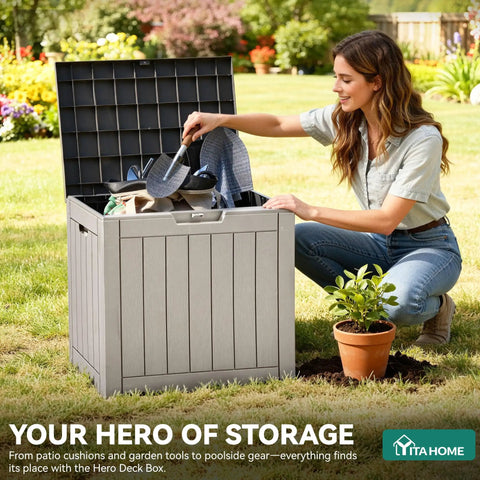 Woman organizing garden tools in an open 31 Gallon Outdoor Storage Deck Box With Lockable Lid, Waterproof Resin Construction, Taupe.