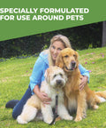 Woman with two dogs on grass, highlighting safe use of Pet Odor Eliminator Spray For Dogs With Natural Enzymes That Kicks Urine, Stool And Vomit Odors.