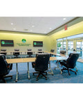 Dual Tech Ultrasonic And PIR Ceiling Motion Sensor With 1000 Sq Ft Coverage White IntelliDAPT installed in modern meeting room